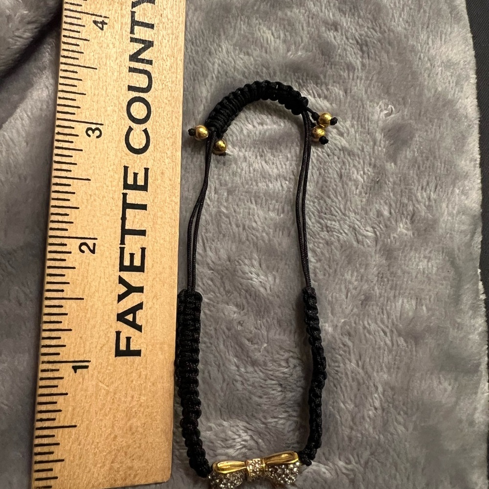Juicy Couture Bolo Black Cord\Rhinestone Bow\Gold Tone Bead Bracelet, excellent - Picture 4 of 5